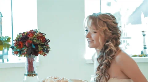 Bride Sits Down to Drink Hot Tea With Her Friend Slow Motion Stock Footage 68689492