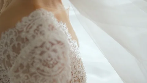 Bride sitting on the bed in her bedroom in the morning Stock Footage 119532479