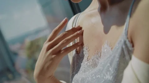 Bride sitting on a window, hands and shoulders. Close-up Stock Footage 67531920