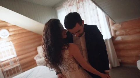 Bride skillfully dancing with her fiance at home in the morning Stock Footage 107398878