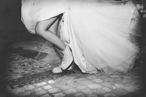 Bride with sneakers Stock Photos