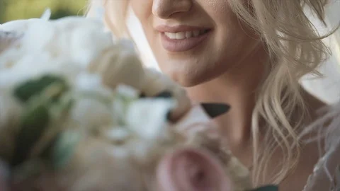Bride Sniffs A Wedding Bouquet. Stock Footage 104869179