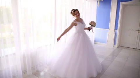 Bride is spinning near the window Stock Footage 66776473