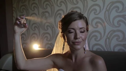 Bride spray perfume slow motion with their eyes closed Stock Footage 74817739