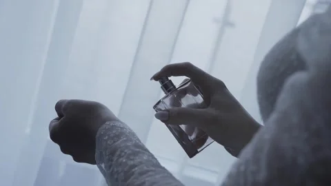 Bride sprays perfume on her hand Stock Footage 306148652