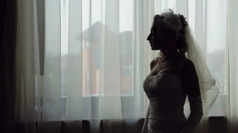 Bride Standing Near Window Stock Footage 25915063