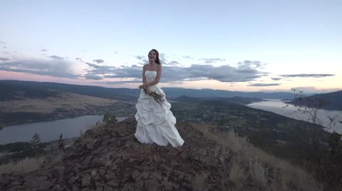 Bride Standing Smiling and Happy on Clifftop Stock Footage 67904648