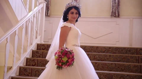 Bride standing on the stairs Stock Footage 68905143