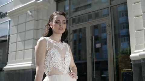 A bride is standing on the street Stock Footage 97845220