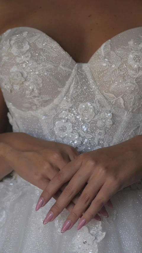 Bride standing while getting ready, white wedding dress decollete, vertical Stock Footage 333052270