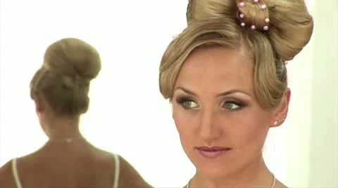 Bride stands against the mirror Stock Footage 11395340