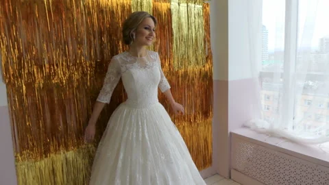 The bride stands against the wall Stock Footage 86596530