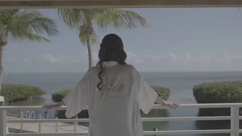 The Bride Stands On The Balcony Back view Stock Footage 179103687