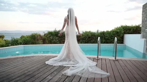 The bride stands by the pool Video stock 239342929