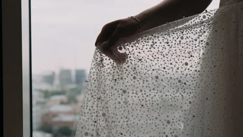 The bride stands at the window and lets go of the veil Video stock 272262833