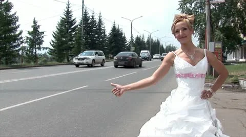 Bride is stopping a car (medium shot) Stock Footage 11291264