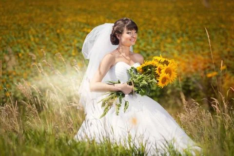 Bride with sunflowers Stock Photos