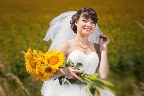 Bride with sunflowers Stock Photos