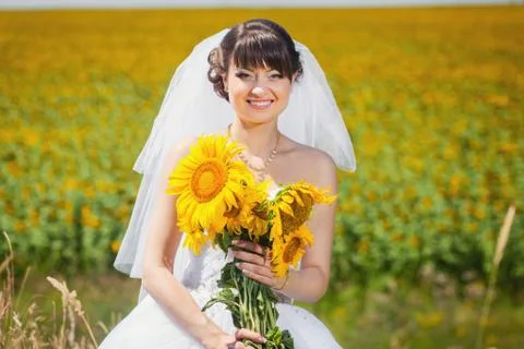 Bride with sunflowers Stock Photos