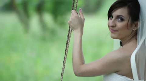 Bride on a swing. Wedding day. Stock Footage 32475842