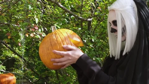 The bride takes the carved pumpkin and dances with it Stock Footage 201200724