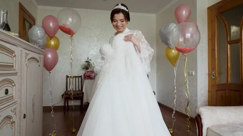 The bride tosses and dancing with her dress in slow motion shot Stock Footage 232950111