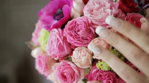 Bride touching bouquet close-up Stock Footage 63160378