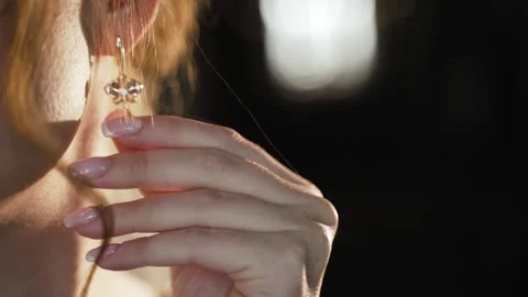 Bride touching gold earring Stock Footage 147753097