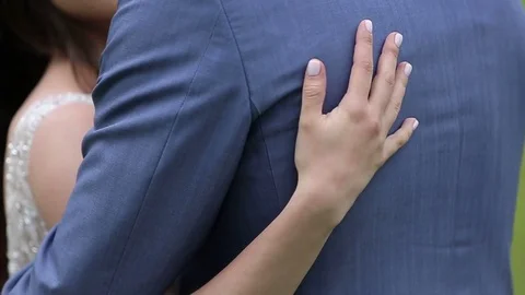 Bride touching groom back Stock Footage 72324379