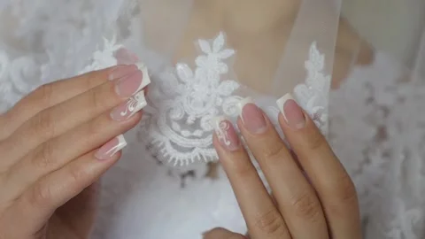 The bride touching her white veil. Stock Footage 89423214