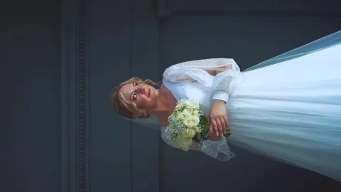 The bride turns to the camera, vertical shooting Stock Footage 252853649