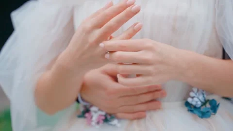 The bride twists her ring on a finger Stock Footage 146242949