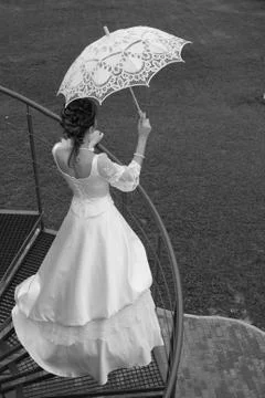 Bride with umbrella. BW. Stock Photos