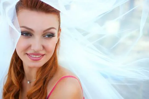 Bride in veil close up outside Stock Photos