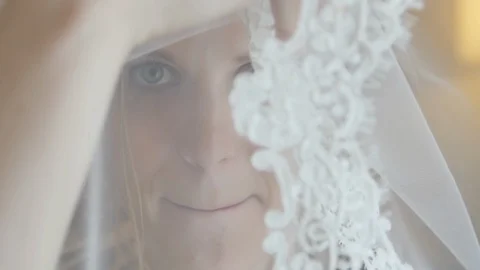 The Bride in a Veil Flirts on Camera Stock Footage 123515165