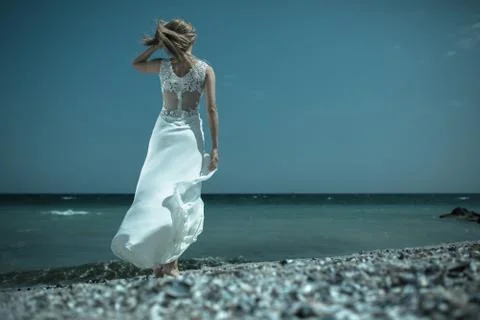 Bride waiting by the shore Фото
