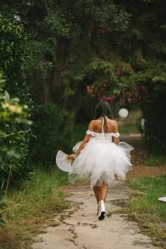 Bride Walking Away Along A Leafy Path Stock Photos