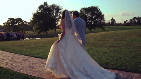 Bride Walking Down Isle with Father From Behind Outdoor Country Wedding Stock Footage 99772444