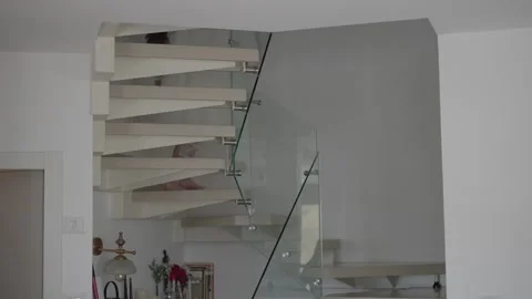 Bride walking down the stairs holding wedding dress. Stock Footage 323805105