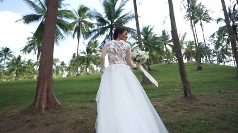 Bride is walking on the island. Stock Footage 60780802