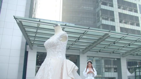 Bride Walking Outdoors Towards Wedding Dress On Mannequin Stock Footage 333374979