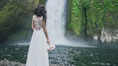 Bride at Waterfall Slow Motion Stock Footage 41756215