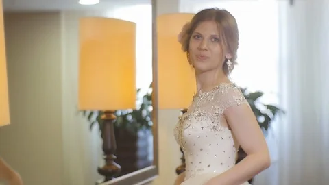 The Bride Waves her Hand to the Camera and Leaves Stock Footage 123515458