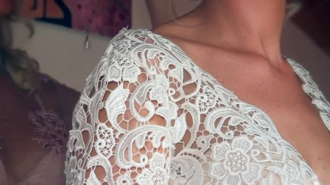 The bride wearing a pendant on the neck Stock Footage 84349495