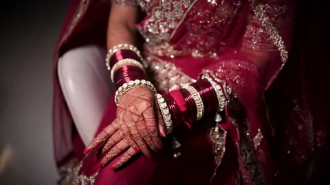 Bride Wearing Traditional Red Bangles and Wedding Attire Stock Footage 341672617