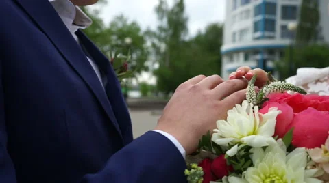 The bride wears the ring to the groom in the park Stock Footage 61783625