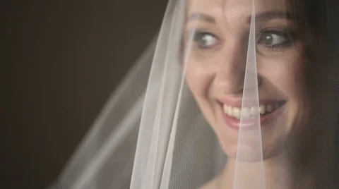 Bride wears a veil at face close up Stock Footage 50805407