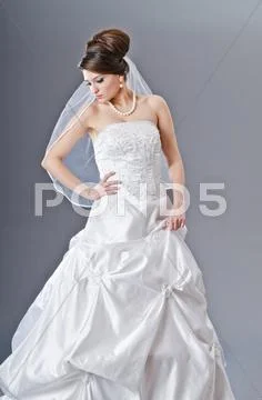 Bride in wedding dress in studio shooting Stock Photos
