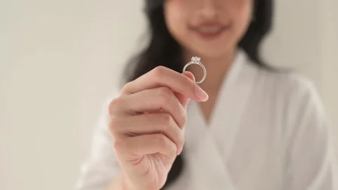Bride in White bathrope with elegant diamond ring preparing for wedding day.. Stock Footage 280205373