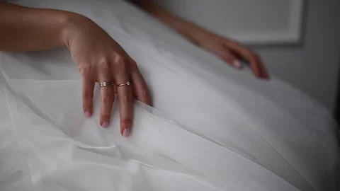 The bride in a white dress with a ring on her hand Stock Footage 166167024
